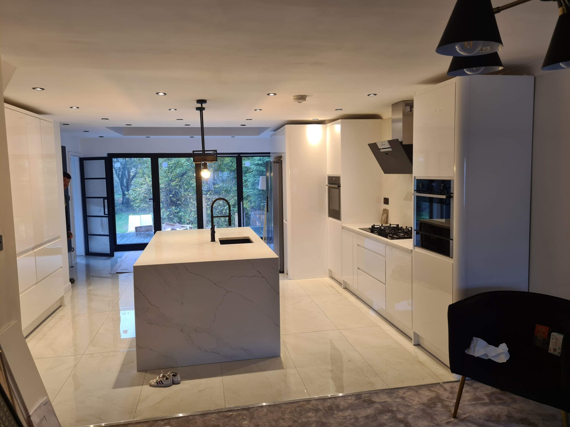 Modern white kitchen with marble island, alternate angle, Leeds kitchen renovation